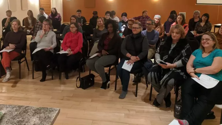 Group of permaculture enthusiasts in a learning session