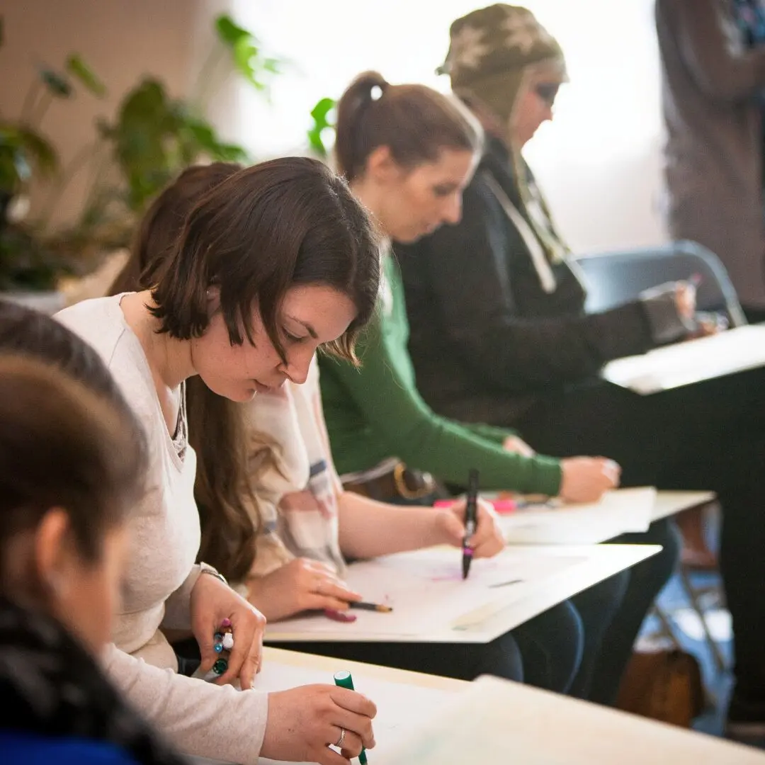 permaculture design students working on site plans